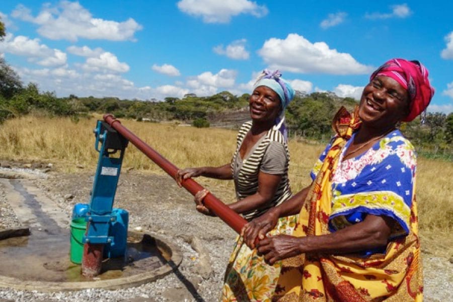 Villages-3-PS900 Two women at a Borehole Pump