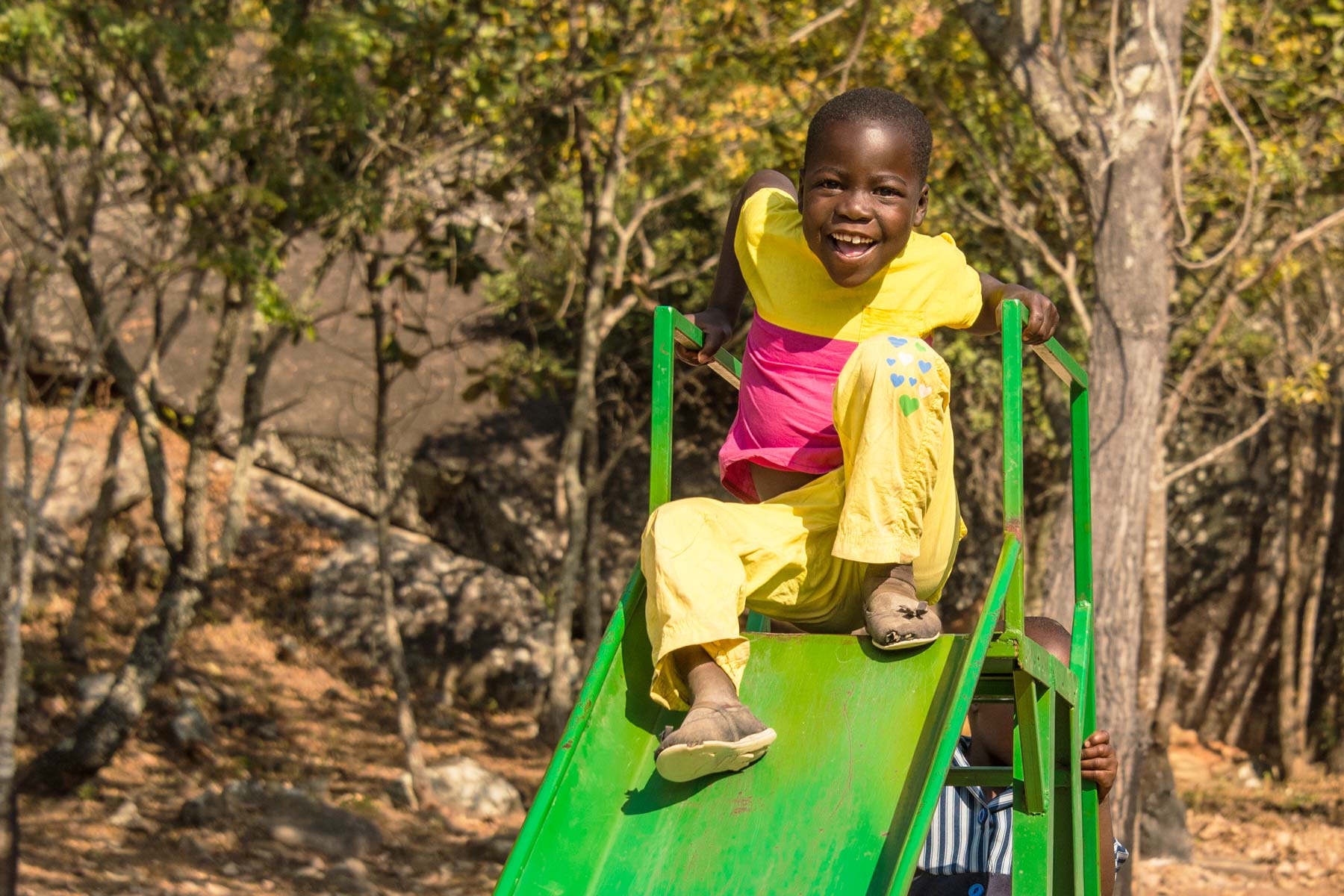 children-belong-in-families-PS1800 children on a slide